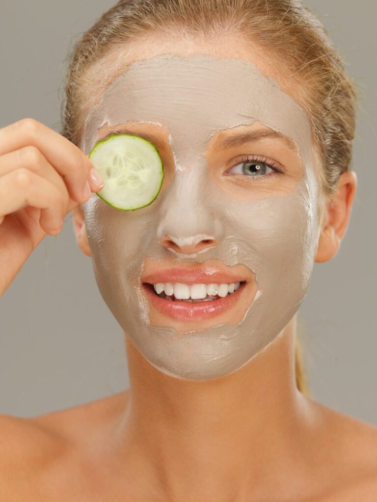 beautiful woman having a facial treatment, smiling